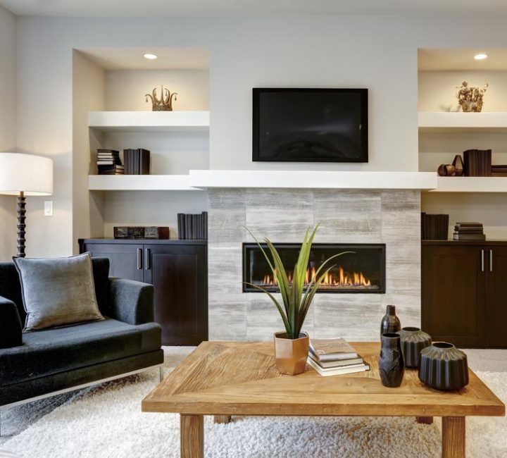 a modern living room with a fireplace